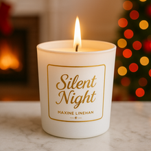 Load image into Gallery viewer, Candle labeled 'Silent Night' by Maxine Linehan with a festive background in Scent White Birch