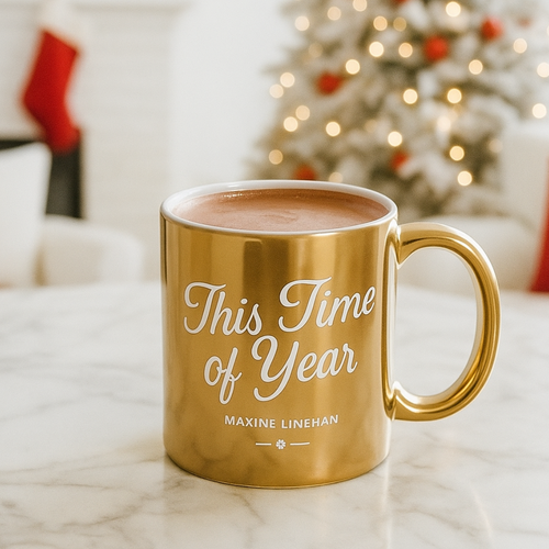 Gold mug with 'This Time of Year' text in a cozy room with a Christmas tree.
